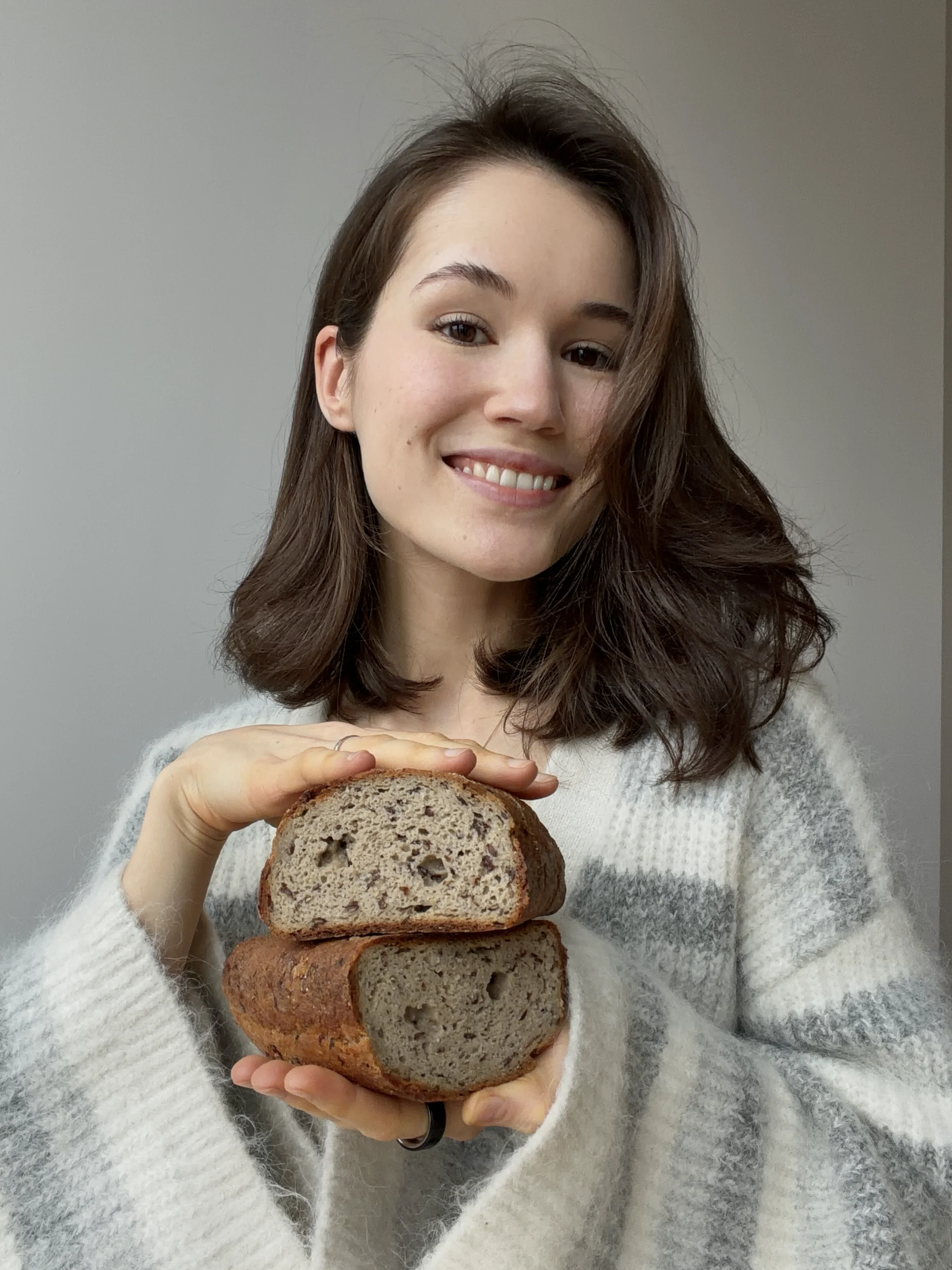 Yana holding freshly baked gluten-free bread